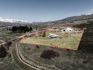 Another aerial view of the property and its boundaries looking towards the home and barn