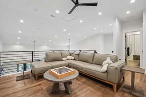 Living area featuring recessed lighting, visible vents, ceiling fan, and light wood-style flooring