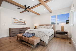 Bedroom featuring wood-type flooring, beamed ceiling, baseboards, and recessed lighting