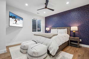 Bedroom featuring visible vents, baseboards, recessed lighting, and wallpapered walls