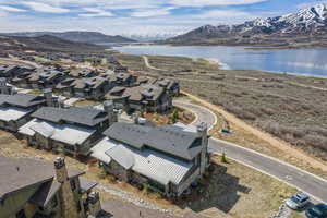 Bird's eye view with a water and mountain view and a residential view