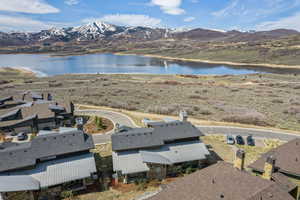 Aerial view featuring a water and mountain view