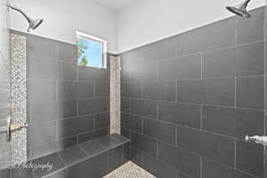 Bathroom featuring a tile shower