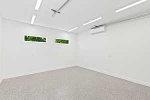 Detached garage with mounted air conditioner