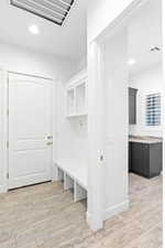 Mudroom featuring light wood-style floors, recessed lighting, and visible vents