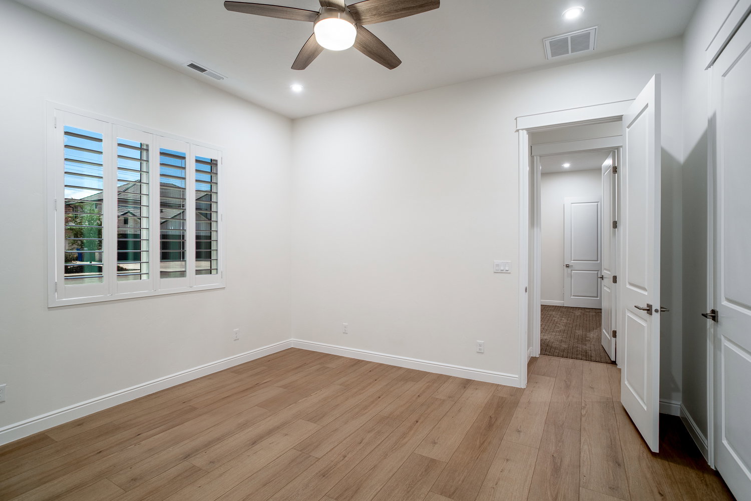 Unfurnished bedroom with visible vents, light wood-type flooring, and recessed lighting