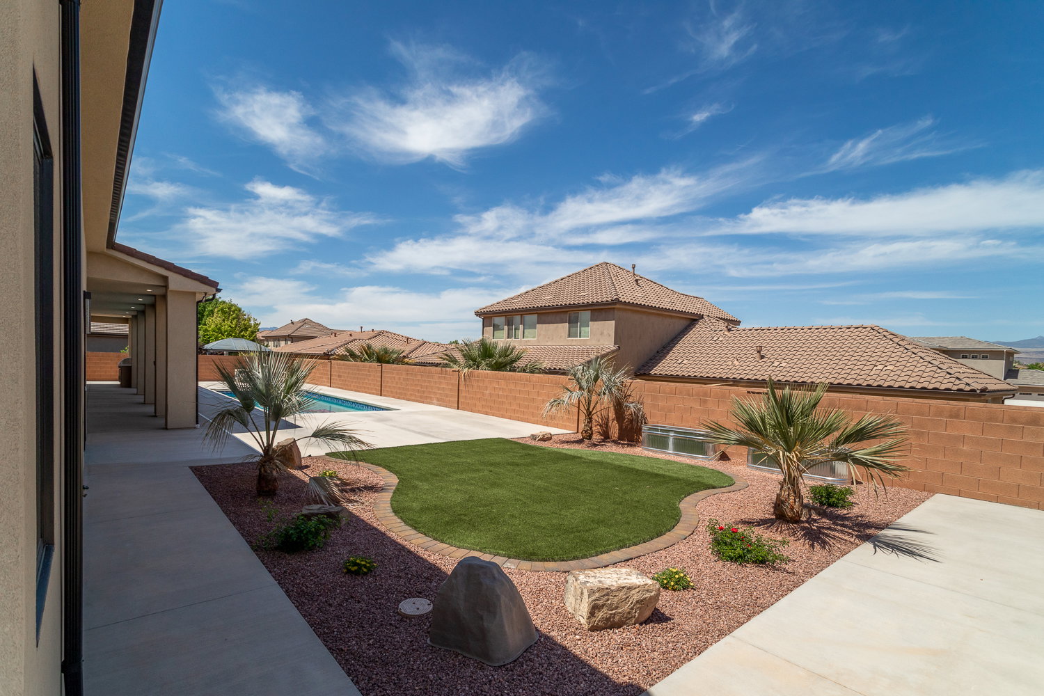 View of yard featuring a fenced in pool, a patio area, and a fenced backyard