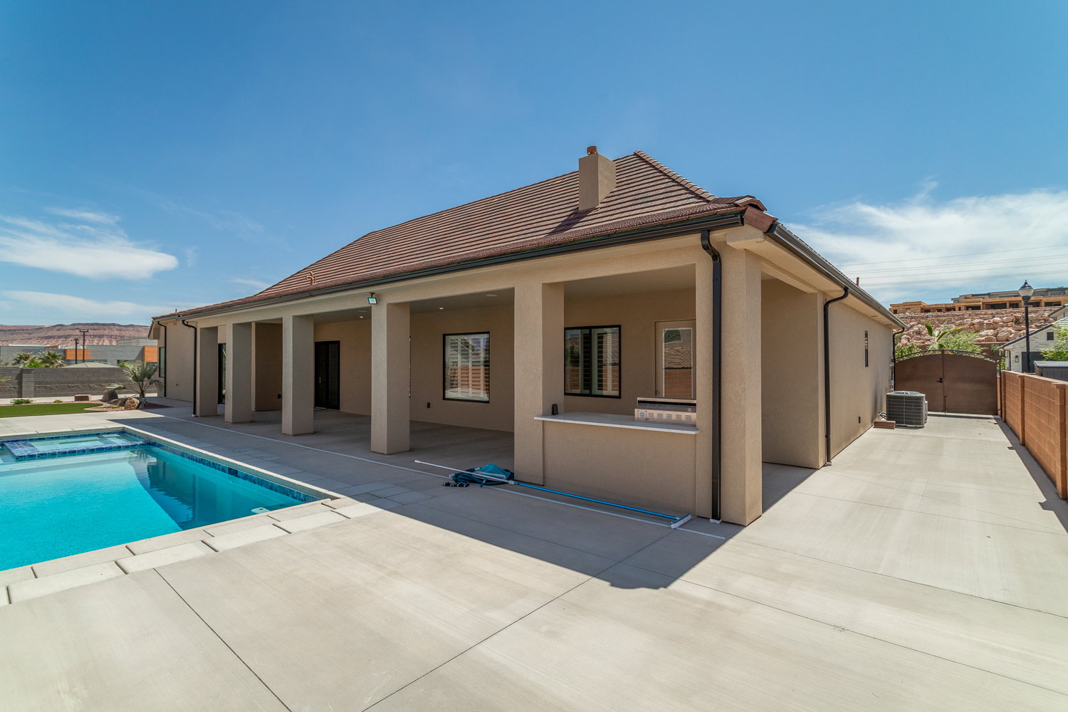 View of pool with a fenced in pool, a patio area, central AC unit, and a gate