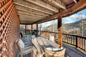 Lower Wooden terrace decl with outdoor dining area