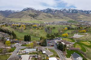 Birds eye view of property featuring a mountain view and a residential view