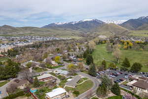 Birds eye view of property with a residential view and a mountain view