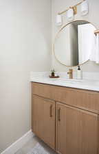 Bathroom featuring vanity and tile patterned flooring