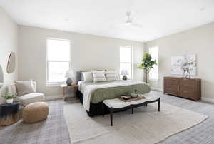 Bedroom with baseboards, a ceiling fan, and light carpet