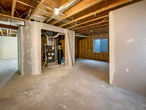 Unfinished below grade area with heating unit