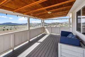 Wooden deck featuring a mountain view