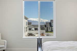Bedroom with a mountain view and baseboards