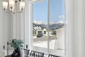 Interior space featuring a mountain view and an inviting chandelier