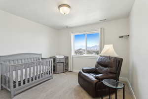 Bedroom featuring visible vents, baseboards, and carpet flooring