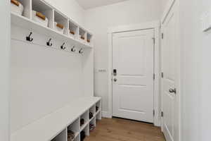 Mudroom featuring light wood-style flooring