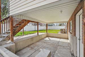 View of patio featuring stairway, a fenced backyard, and cooling unit