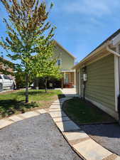 Back yard with stepping stones to garden and private patio