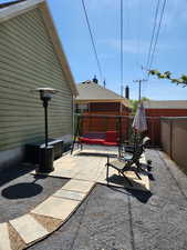 View of patio featuring a fenced backyard and a hot tub