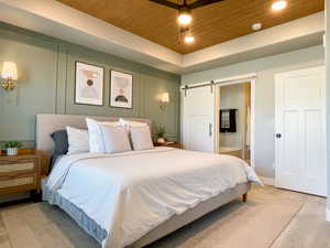 Primary Bedroom with a barn door