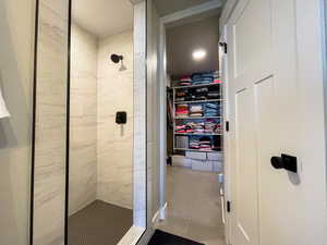 Bathroom leading to Primary Bedroom Closet