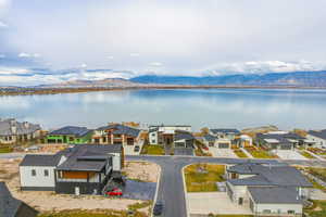 Aerial perspective of suburban area featuring a water and mountain view