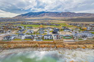 Aerial perspective of suburban area with a water and mountain view