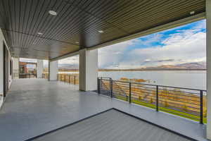 View of patio featuring a water and mountain view
