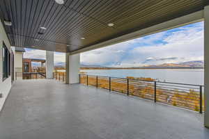 View of patio with a water view