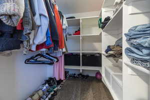 Spacious closet with carpet