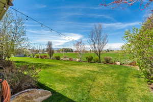 View of yard with a rural view