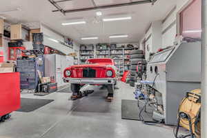 Garage with white fridge with ice dispenser