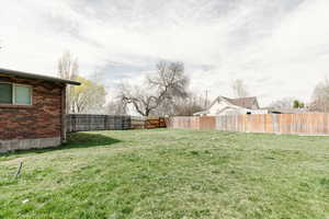 View of yard featuring a fenced backyard