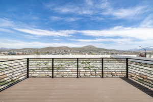 Wooden deck featuring a mountain view