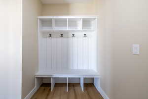 Mudroom with baseboards and wood finished floors