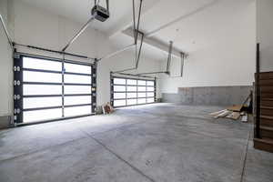 Garage featuring a garage door opener