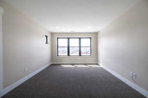 Carpeted empty room featuring recessed lighting, visible vents, and baseboards