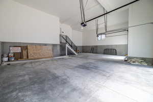 Garage featuring a garage door opener