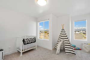 Carpeted bedroom featuring baseboards