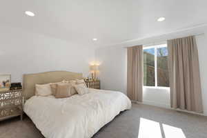Bedroom with recessed lighting and carpet