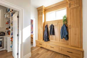 Mudroom with light wood-type flooring