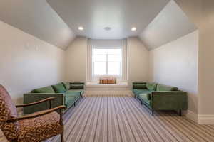 Sitting room featuring recessed lighting, carpet, baseboards, and lofted ceiling