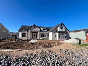 View of front facade with stone siding