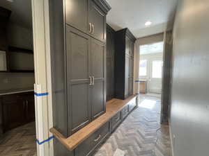 Mudroom featuring recessed lighting and a textured ceiling