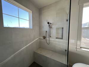 Full bathroom featuring tiled shower