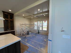 Interior space featuring beamed ceiling, recessed lighting, and baseboards