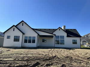 Rear view of house with covered back patio